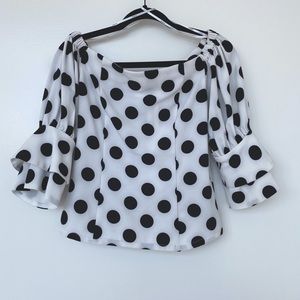 Polka dot blouse with ruffled sleeves
